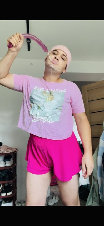 sissy in pink fucks her mouth with a dildo
