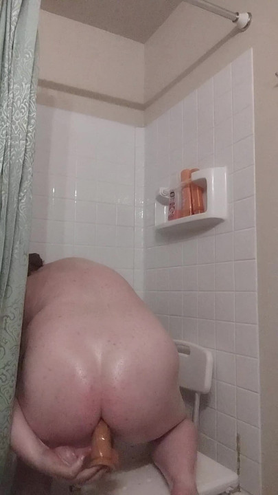Shower slut takes dildo deep in ass