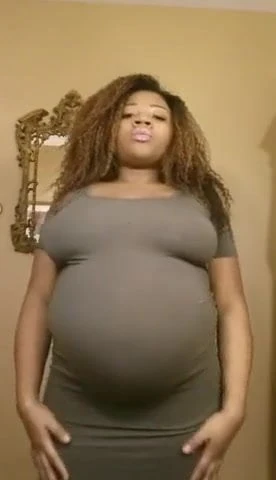 Pregnant ebony belly rub