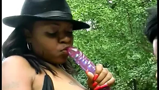 Thick black slut lifts legs to get her wet pussy licked by a chick