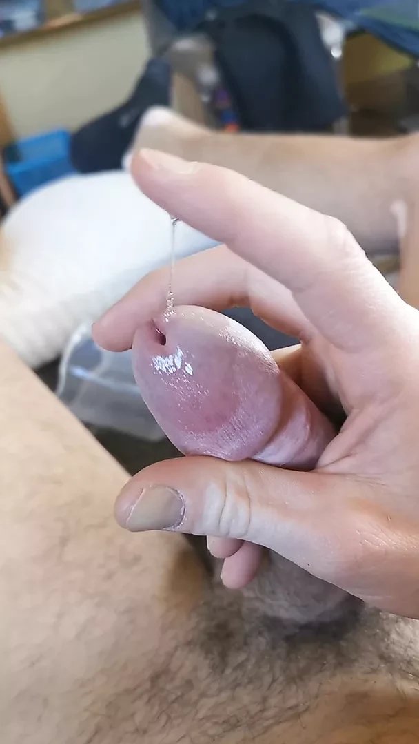 Masturbating on couch and cumming in a cup