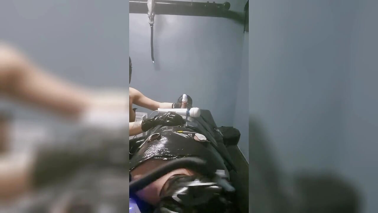 The Slave Suffers with a Breathing Mask During Hard Dilation.