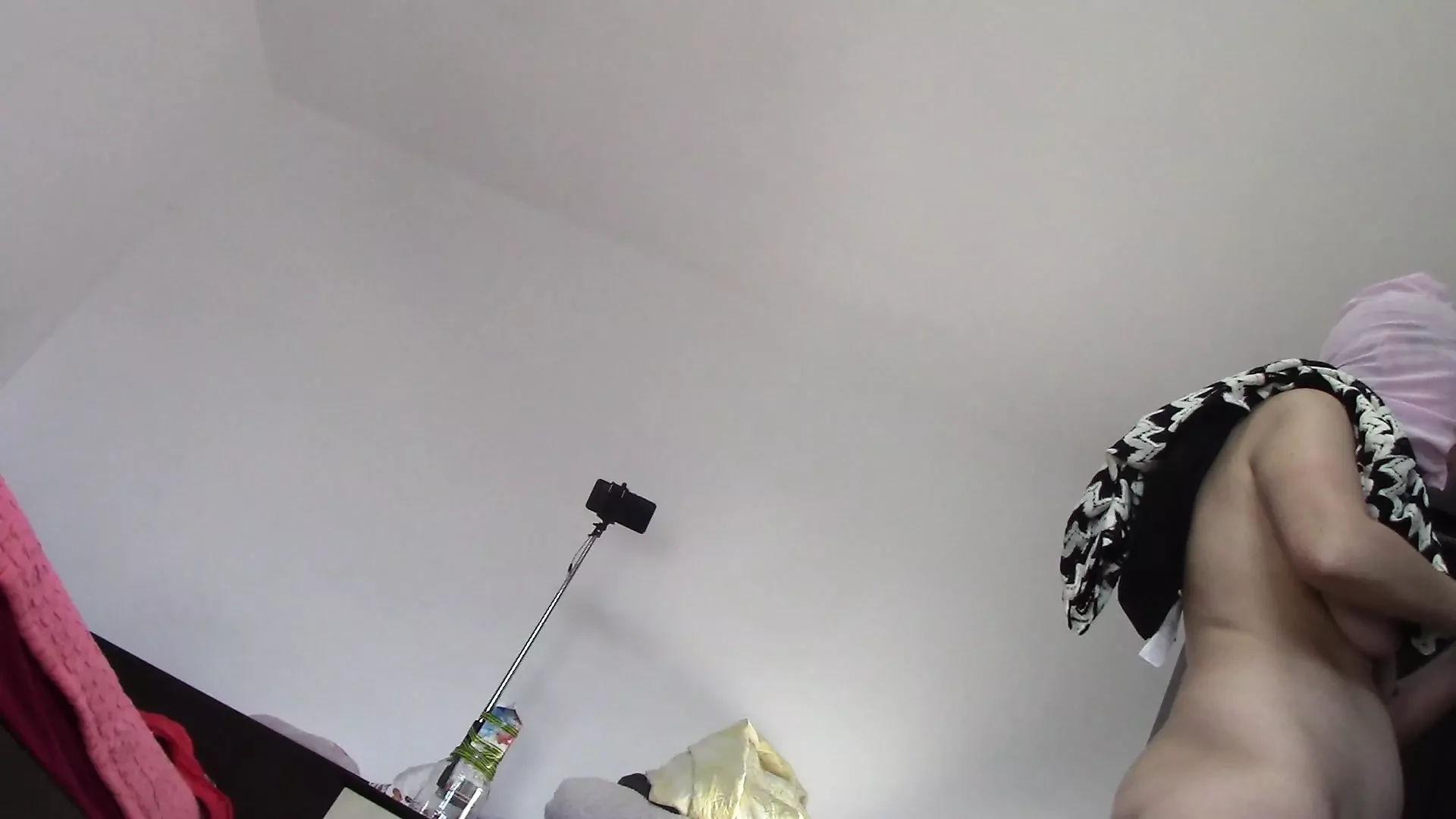 Amateur wife dancing naked at home. Amateur woman has fun trying on clothes and cutting them