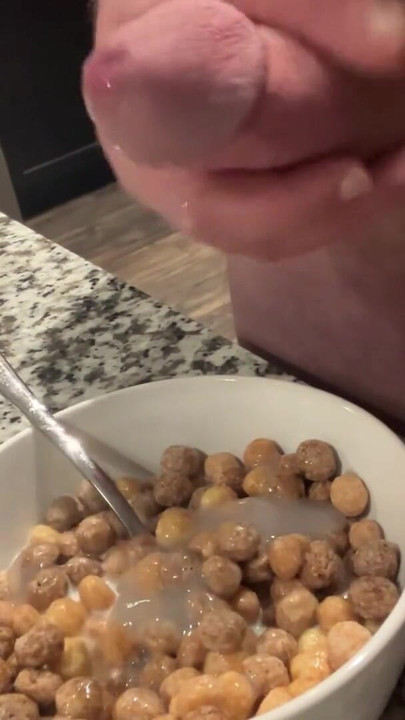 Key moment from "Hung Bodybuilder Unloads Multiple Cumshots Into Cereal"