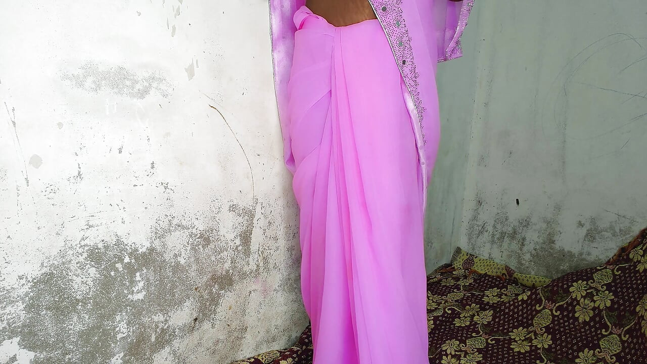 I am an Indian woman ready to have sex while wearing a pink Indian saree.
