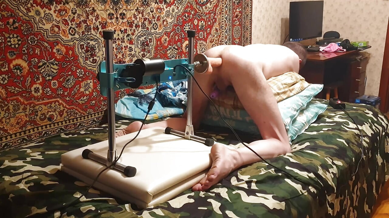 Hot gay having sex with a fuck machine