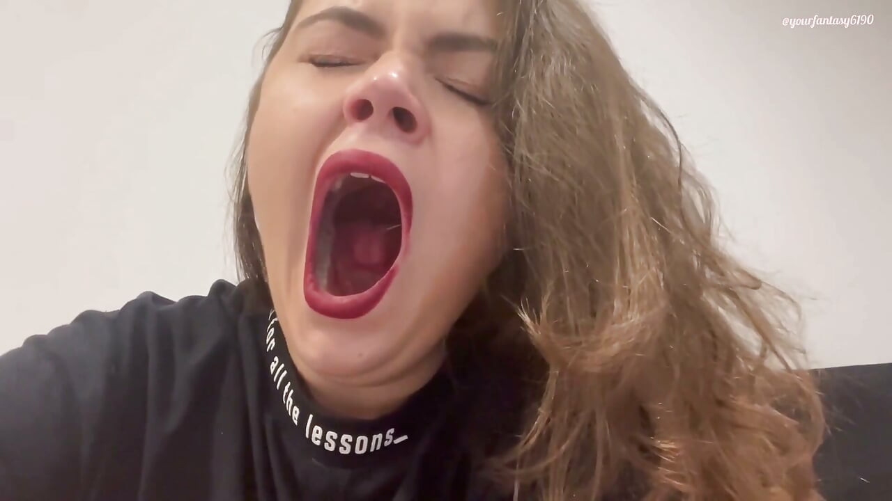 Yawning with red lipstick