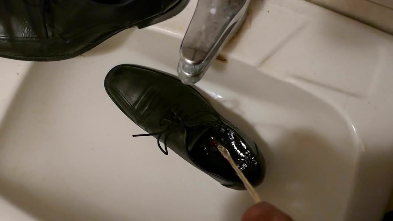 Piss in men's dress shoe
