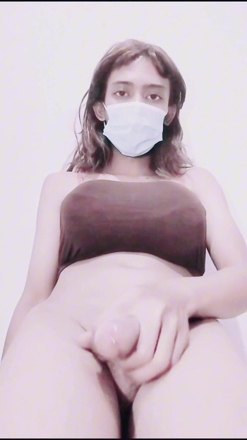 Iconic moment from "Tiny Asian CD Sissy Trans Masturbation After Work"