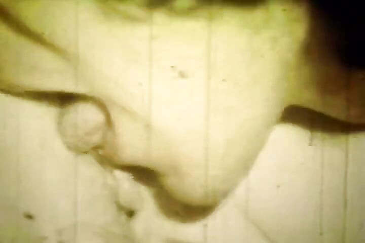Worn Sepia Loop Captures Curly Retro Couple in Raw Bedroom Passion