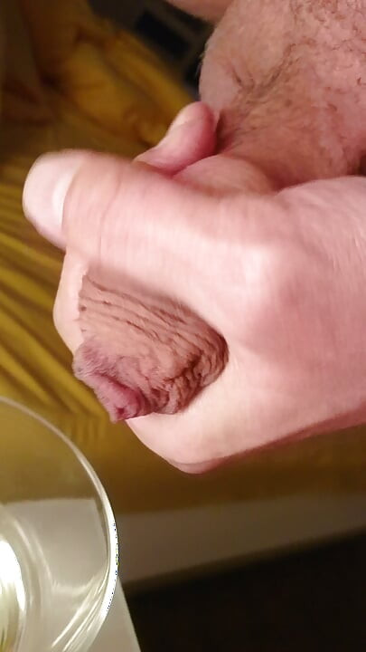 Cumming into a glass of pee