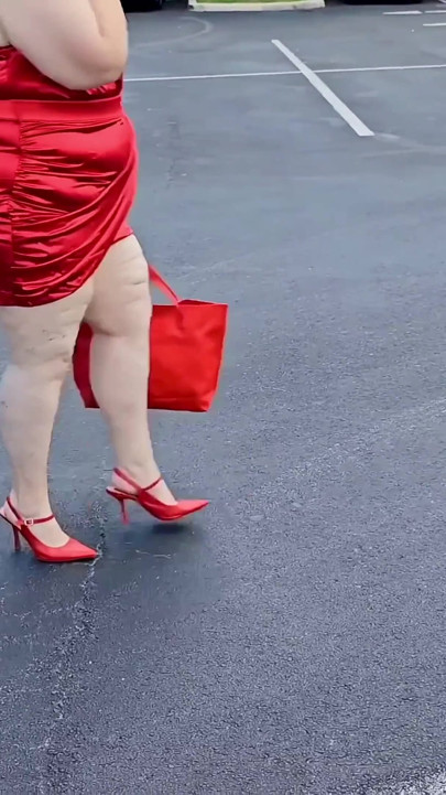Beautiful Woman Walking Outdoors in  Parking Lot Showing off for Strangers