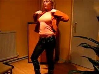 Blonde girl in tight leather look pants