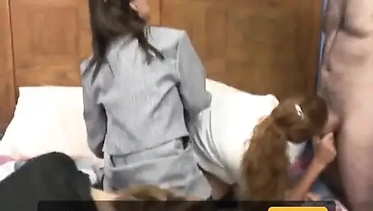 Mature Brunette Sucks Young Guy as Two Cute Coeds Share Old Penis on a Bed
