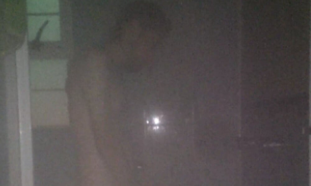 Man Showering with Flashlight On