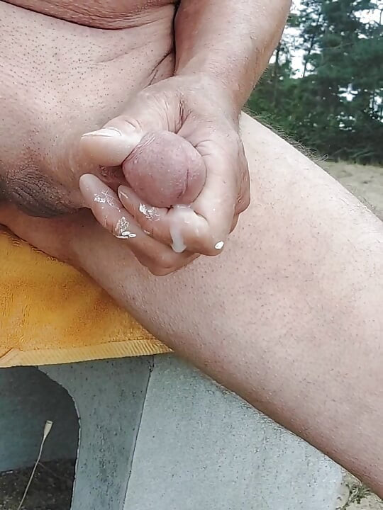Jerked off and cummed on the nudist beach