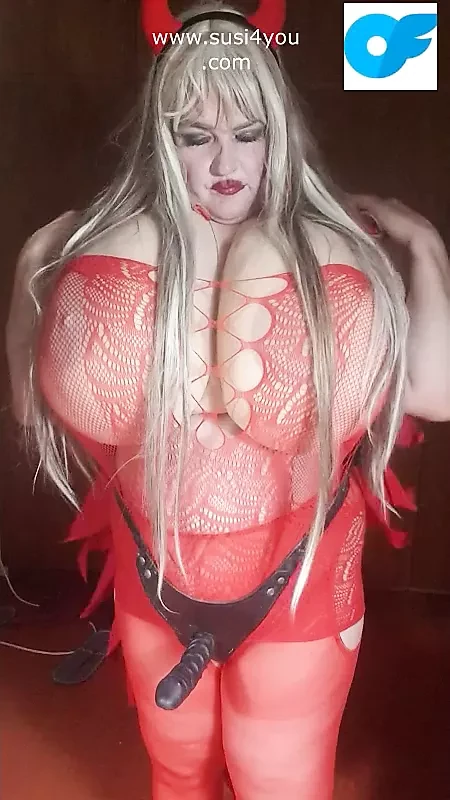 Red devil lady with strapon is giving instructions