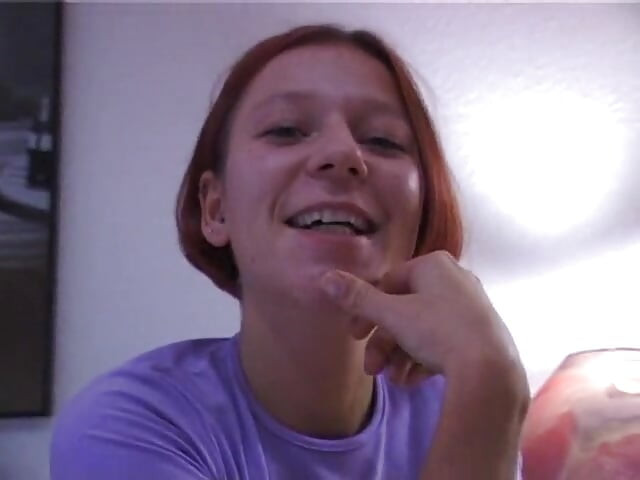 Redhead girl rubs and fingers her wet twat