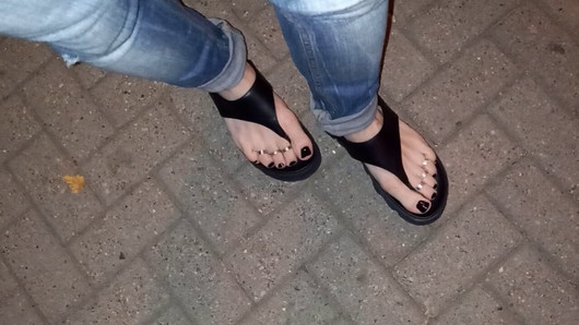 I tempt you with my sexy feet while walking on the street