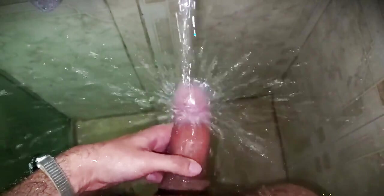 No hands water masturbation. Letting the stream of water fall on my big uncut Latino cock until it makes me cum.