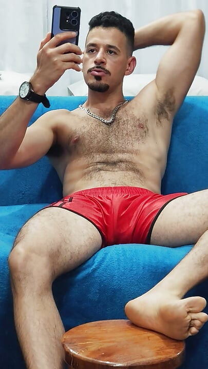 Teasing with red football shorts