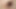 彼のカットされていない剃毛された弛緩したペニスを示すポーズをとるジャンパーだけの称賛