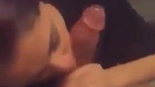 Brunette licking and sucking a black cock