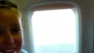 Boquete loira em um avião