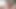 ベッドの上で裸でペニスを引っ張ってる