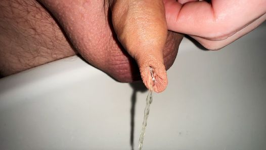 play with my small foreskin cock while pissing