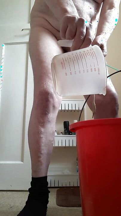 Bucket water tied onto my balls