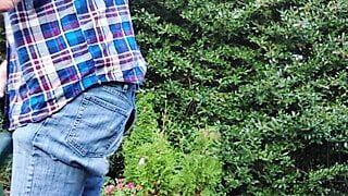 Gardener dad moving plants, then takes a break for a smoke