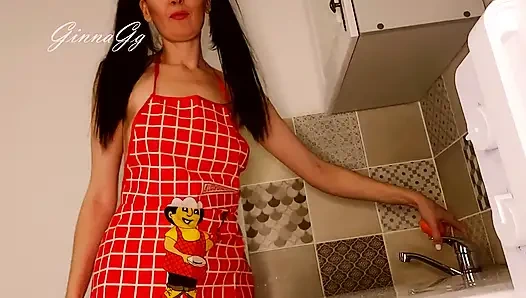 Hot housewife sexually rustles her apron in the kitchen