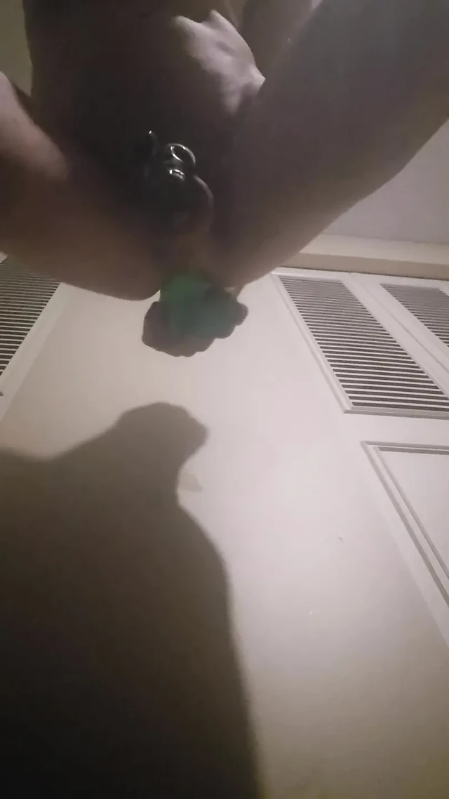 Caged sissy taking huge dildo