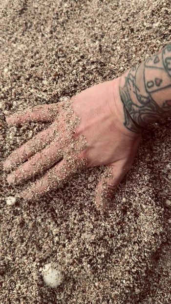 British Dannyroyal Playing around with the sand on the beach