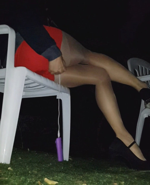 Young asian in tight red skirt, sheer pantyhose and highheels came to public park with vibrator inside. Control her with remote-