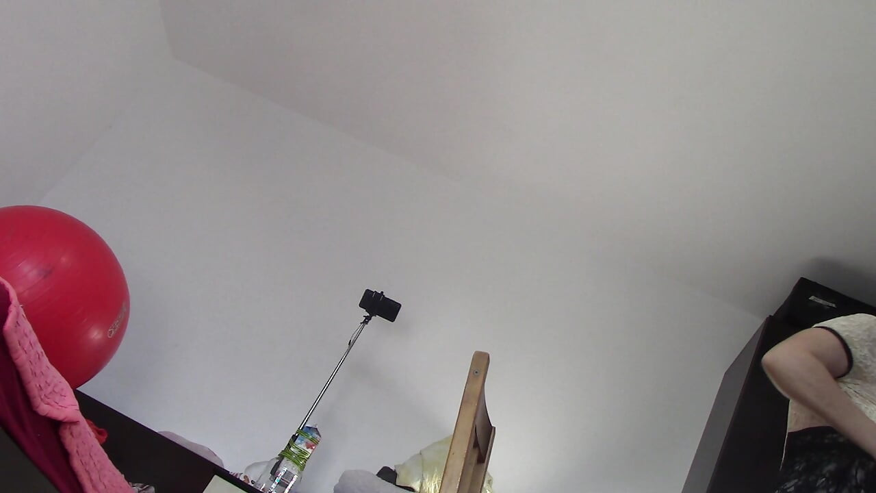Amateur wife dancing naked at home. Amateur woman has fun trying on clothes and cutting them.