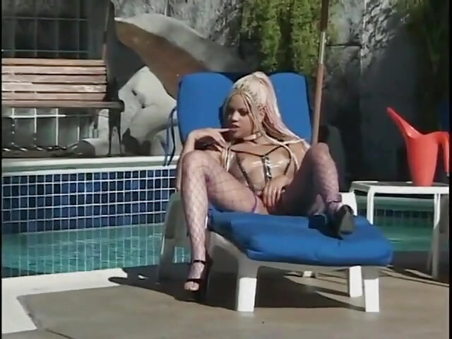 Two guys wearing masks get their large cocks sucked by a hot chick in latex gear