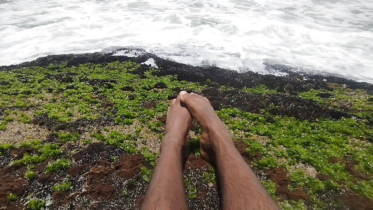 massaging my feet on the beach
