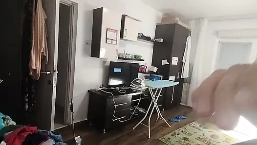 Sexy brunette doing naked chores around the house.