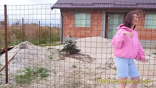Hipster  redhead teen smokes and pee in her short jeans shorts, changes wet clothes and pee outdoor