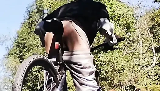 Slim boy with his bike in the park
