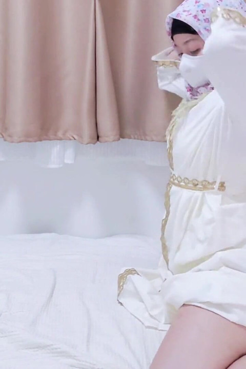 A Malaysian Hijabi Girl Teasing with White Abaya Showing off Her Ass