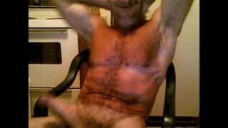 Muscledude sitting dicked,, stroking cock and cummin