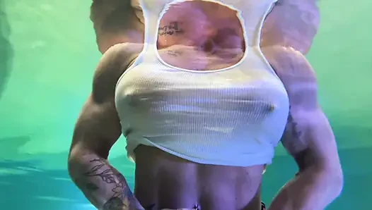 Amazon Kandy Flexes Her Massive Biceps in Her Hotel Pool