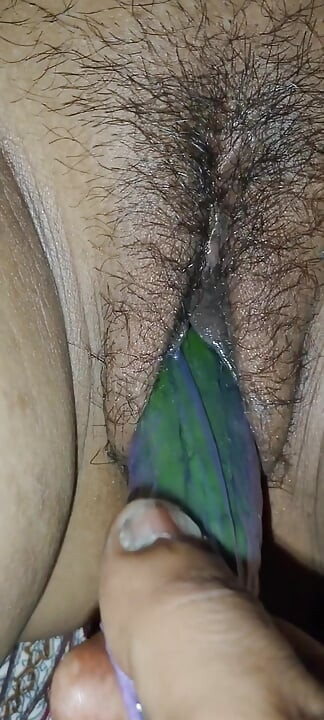 Indian desi sister-in-law with cucumber