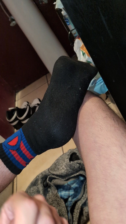 Jacking off naked in my black and red socks
