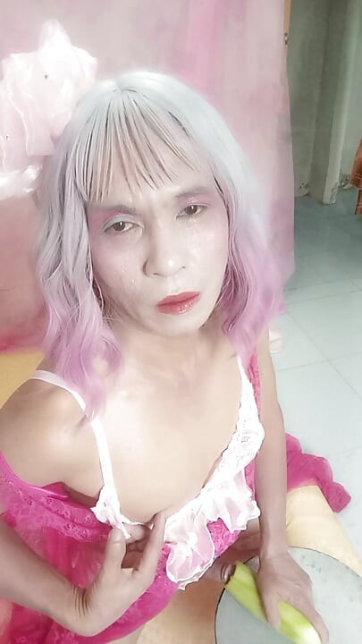 Transgender Oanh Le wears a sexy dress and masturbates.