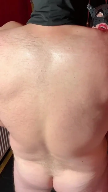 Iconic moment from "Sex Swing Sub has her ass stretched with giant red dildo and fucked in her shaved pussy at the same time"