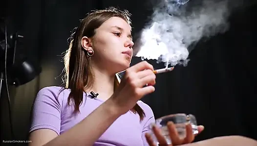 18 Aged Girl Is Smoking Two Strong Cork Cigarettes